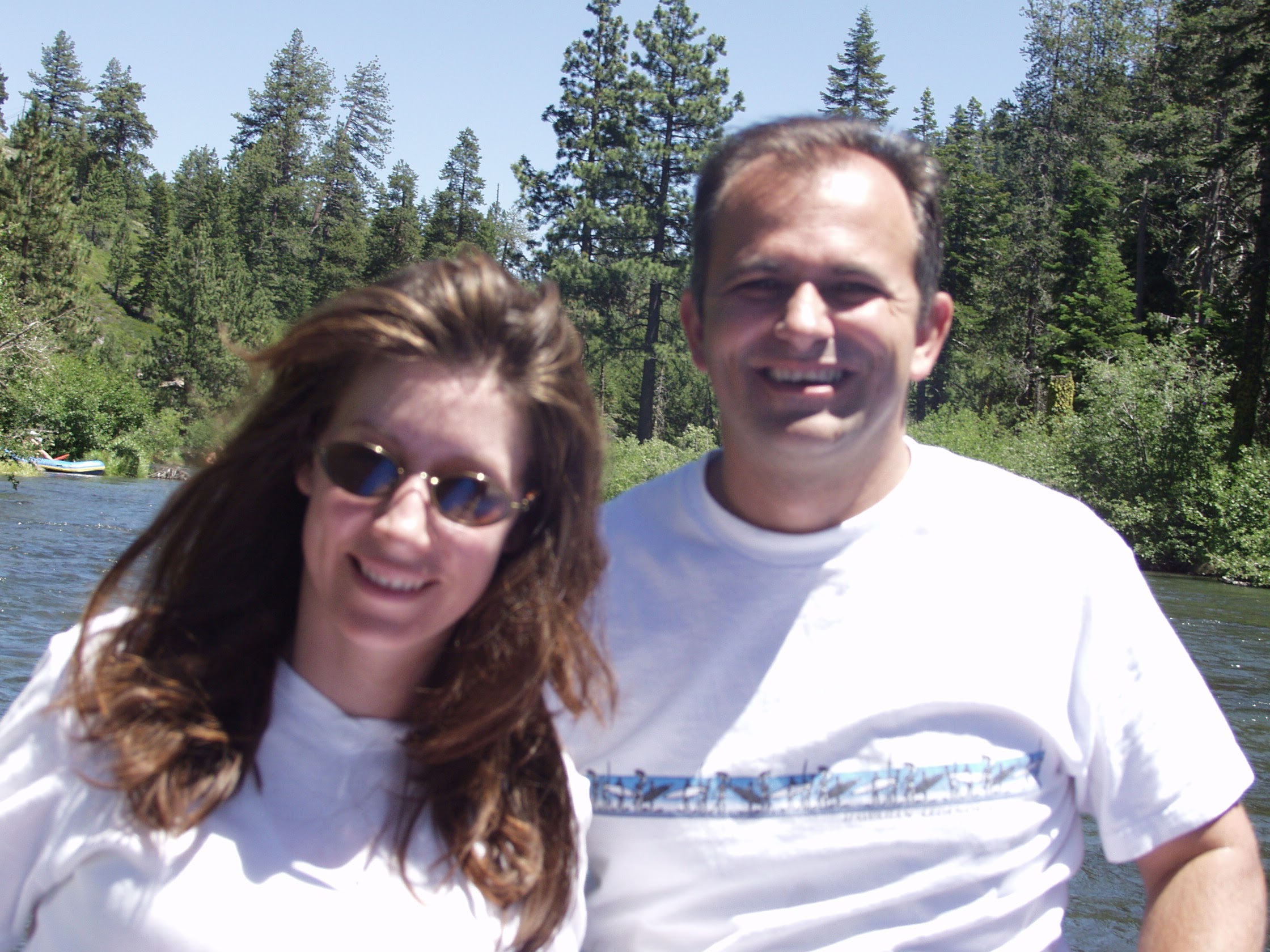 Themio and Christian smiling on the water, July 2003