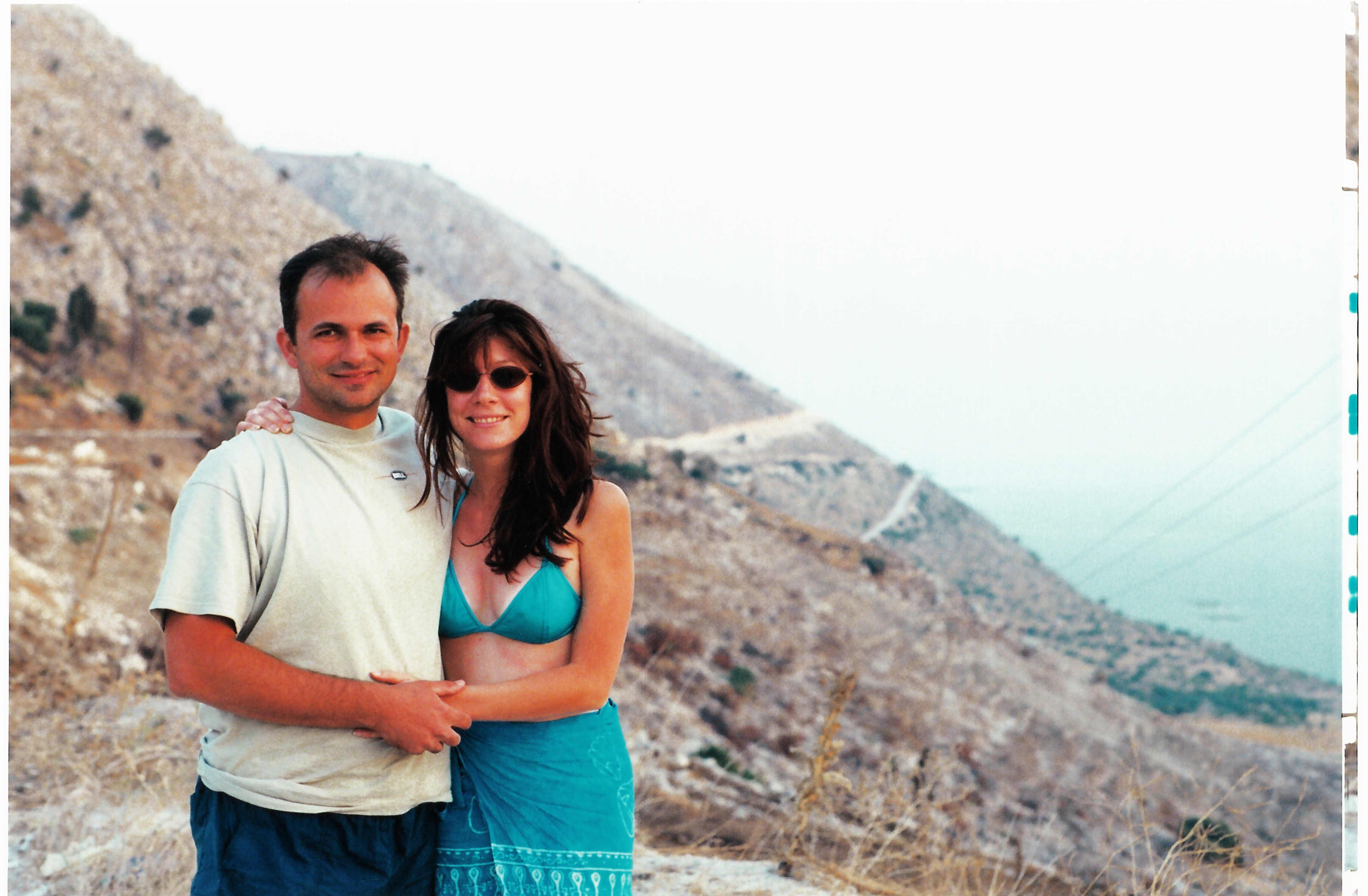 Themio and Christian on a sunny coastal overlook