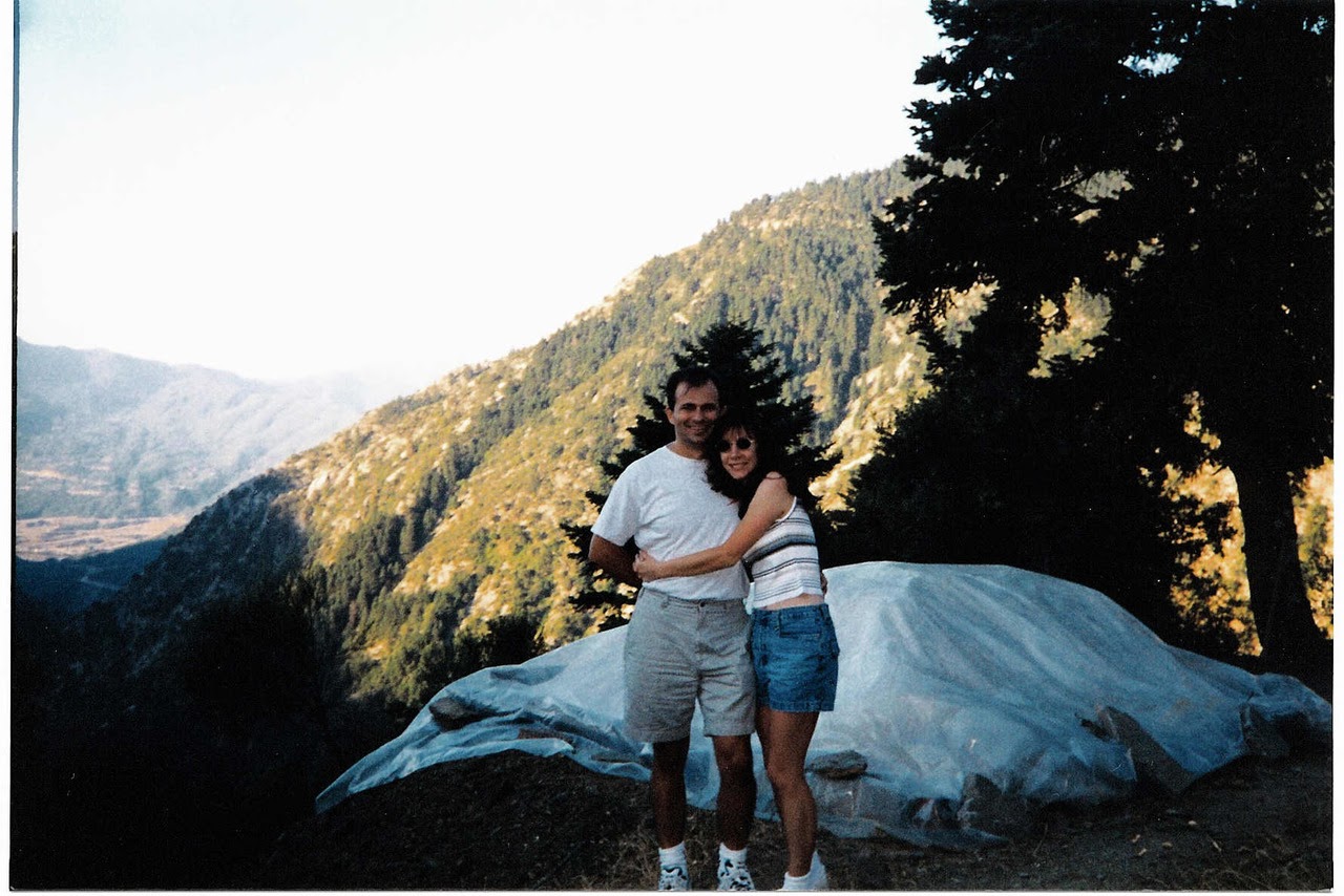 Younger Themio and Christian embracing in the mountains